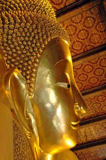 face of reclining buddha-AsiaPhotoStock